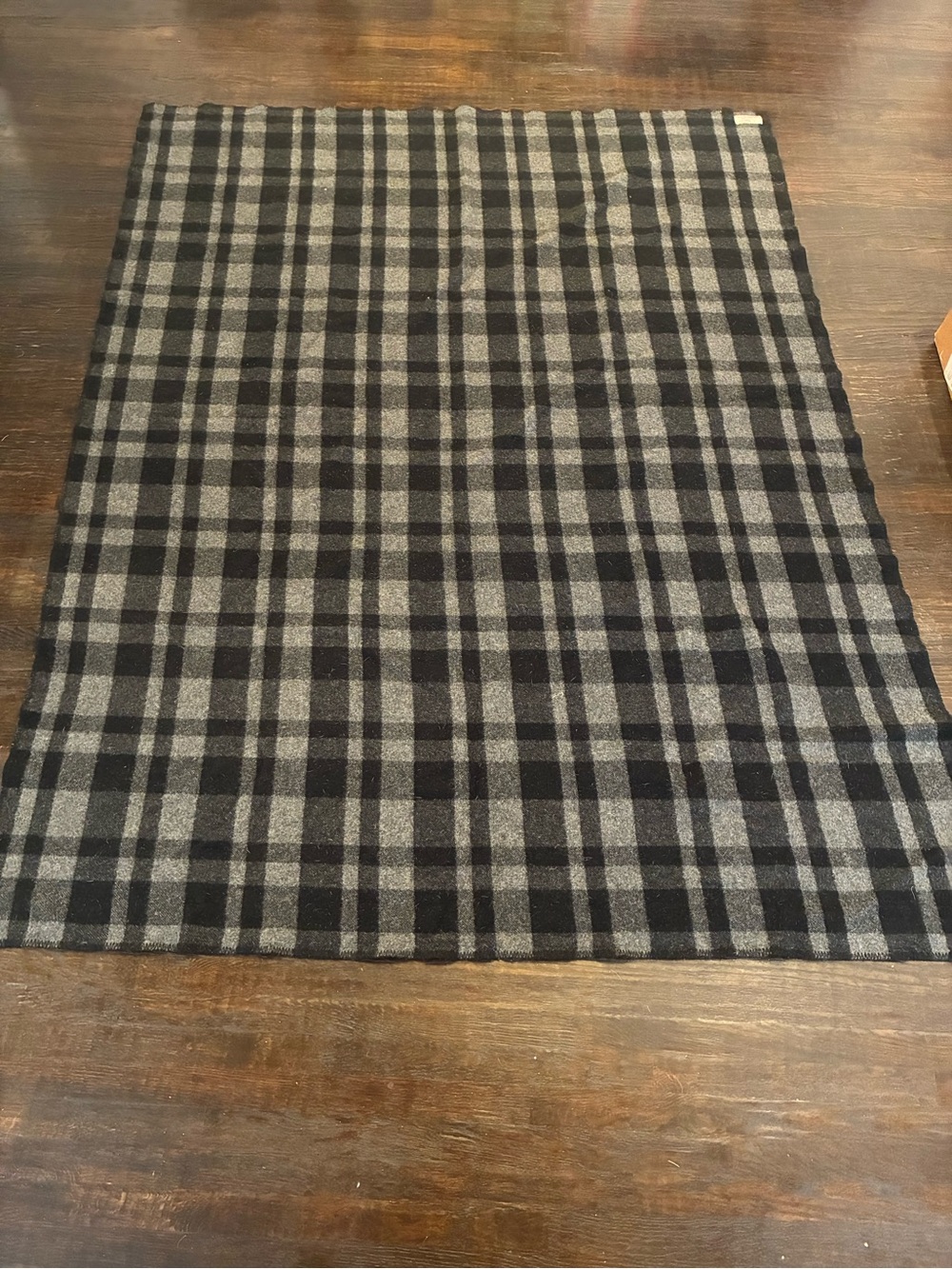 Filson Vintage Wool Mackinaw Blanket in a gray and black plaid pattern